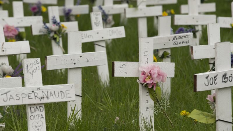 Crosses  outside the Camilla Care long term care home in Mississauga, Ontario, remain as a reminder of those lost inside the facility to Covid-19  in 2020. Photograph: Rick Madonik/Toronto Star via Getty Images