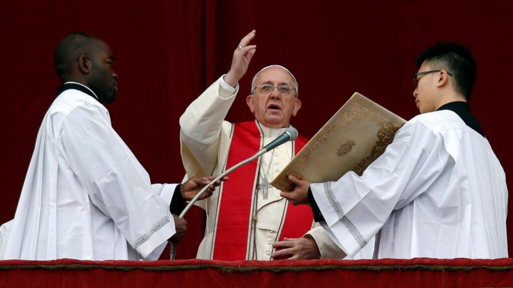 Pope Francis gives a blessing as he delivers his first ‘Urbi et Orbi’ (to the city and world) message from the balcony overlooking St Peter’s Square at the Vatican today. Francis, celebrating his first Christmas as pope, called for dialogue to end the conflict in South Sudan and all wars, saying everyone should strive to be personal peacemakers. Photograph: Alessandro Bianchi/Reuters