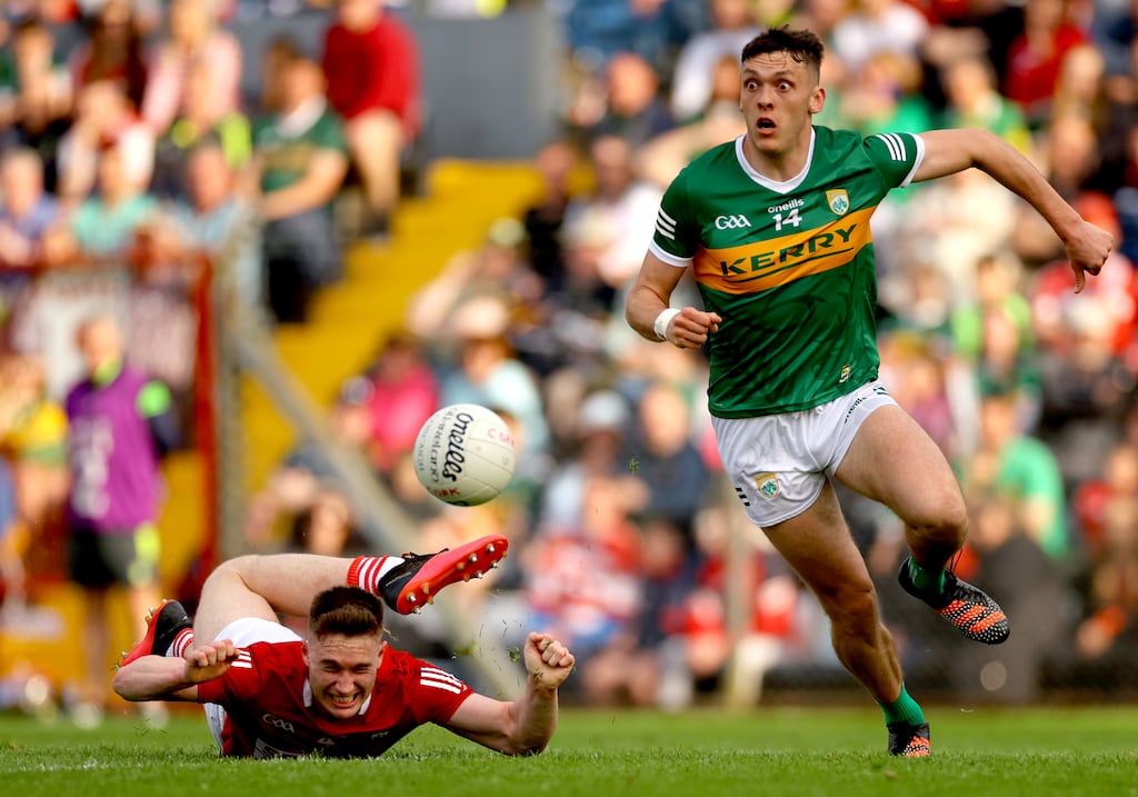 Cork's Kevin Flahive is outmanoeuvred by Kerry's David Clifford who closes on the ball in last season's encounter between the old foes. File photograph: James Crombie/Inpho