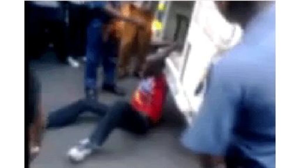 The South African police watchdog is investigating the death of a man who was apparently filmed being handcuffed to the back of a police van and dragged along the ground. Image: The Daily Sun/Screengrab.