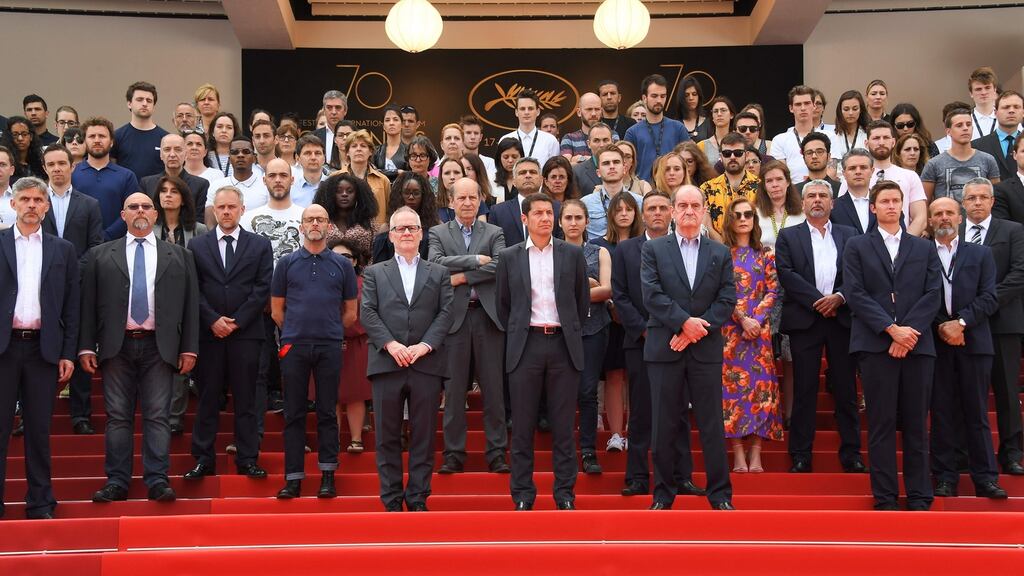 Members of the Cannes Film Festival’s staff observe a minute’s silence to pay homage to the victims of the Manchester terrorist attack on Tuesday. Photograph: Anne-Christine Poujoulat/AFP/Getty Images
