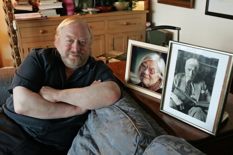 Paddy Smyth, son of Jennifer Johnston, at home in Dublin with portraits of his author mother and playwright grandfather Denis Johnston. Photograph: Frank Miller