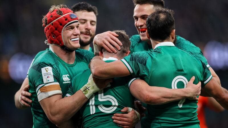 Michael Lowry celebrates scoring Ireland’s sixth try with Josh van der Flier, Robbie Henshaw, James Hume and Jamison Gibson-Park. Photograph: James Crombie/Inpho