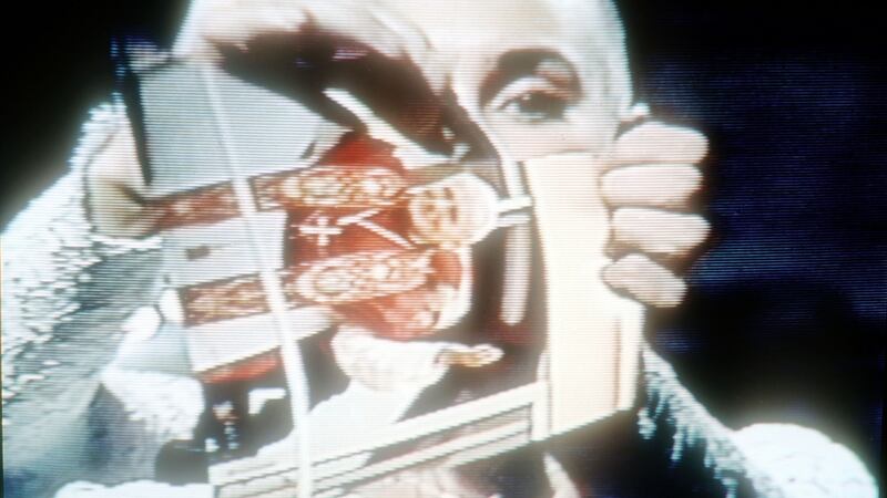 Sinéad O’Connor rips up a picture of Pope John Paul II on the TV show Saturday Night Live. Photograph: Yvonne Hemsey/Getty Images