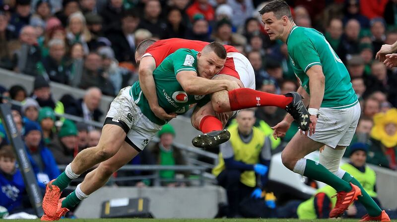 Ireland’s Andrew Conway tackles Wales’ Ken Owens. Photograph: Donall Farmer/PA Wire