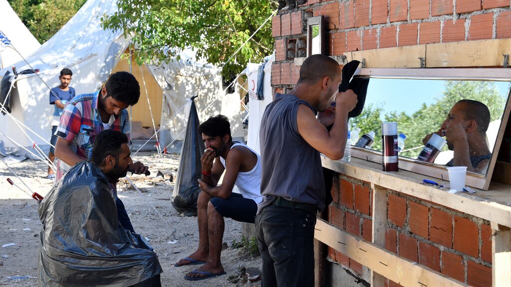 Migrants outside the camp. ‘As the authorities are aware, the Vucjak site is located close to landmine-infested areas and there is a high risk of fire and explosions due to possible underground pockets of methane gas,” the UN said. File photograph: Elvis Barukcic/AFP/Getty Images