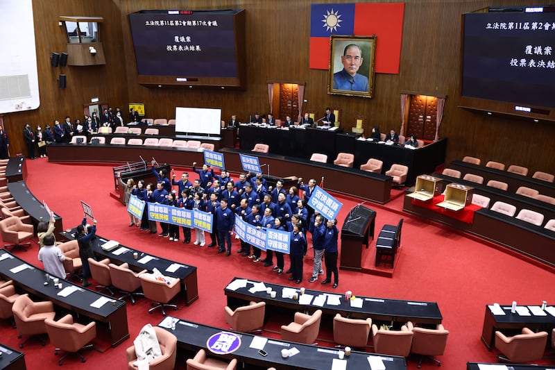Taiwan's opposition party Kuomintang (KMT) lawmakers shouting slogans during a dispute on planned legislation in Taipei earlier this year. Photograph: Annabelle Chih/ AFP/ Getty Images