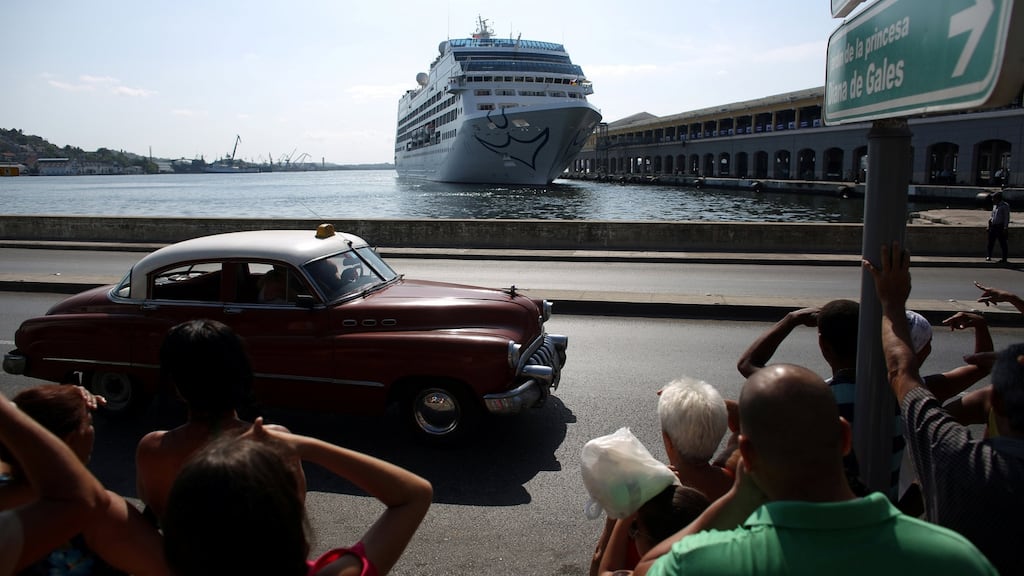 People look at the arrival of US Carnival cruise ship Adonia at the Havana bay, the first cruise liner to sail between the United States and Cuba since Cuba’s 1959 revolution, Cuba. Photograph: Alexandre Meneghini/Reuters