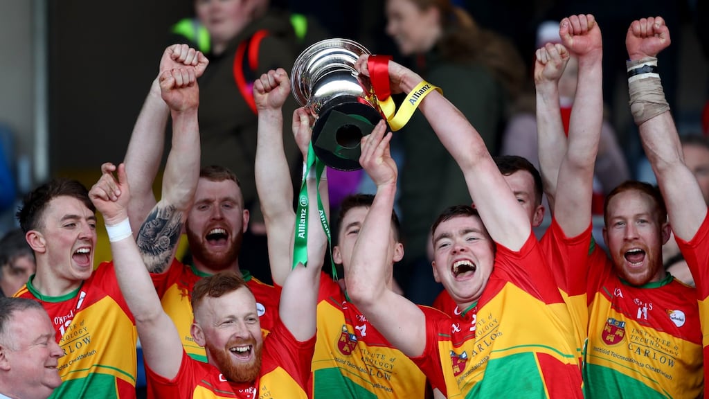 Carlow’s Richard Coady and Diarmuid Byrne lift the trophy after winning the Division 2A hurling league final. Photograph: James Crombie/Inpho