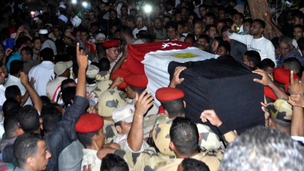 Egyptian mourners attending the funeral for one of the soldiers killed in a suicide attack in Sinai. Photograph: Eadwan Abou Magd/EPA