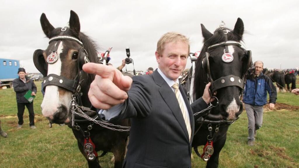 Enda Kenny getting a handle on other farm animals. Photograph: Alan Betson