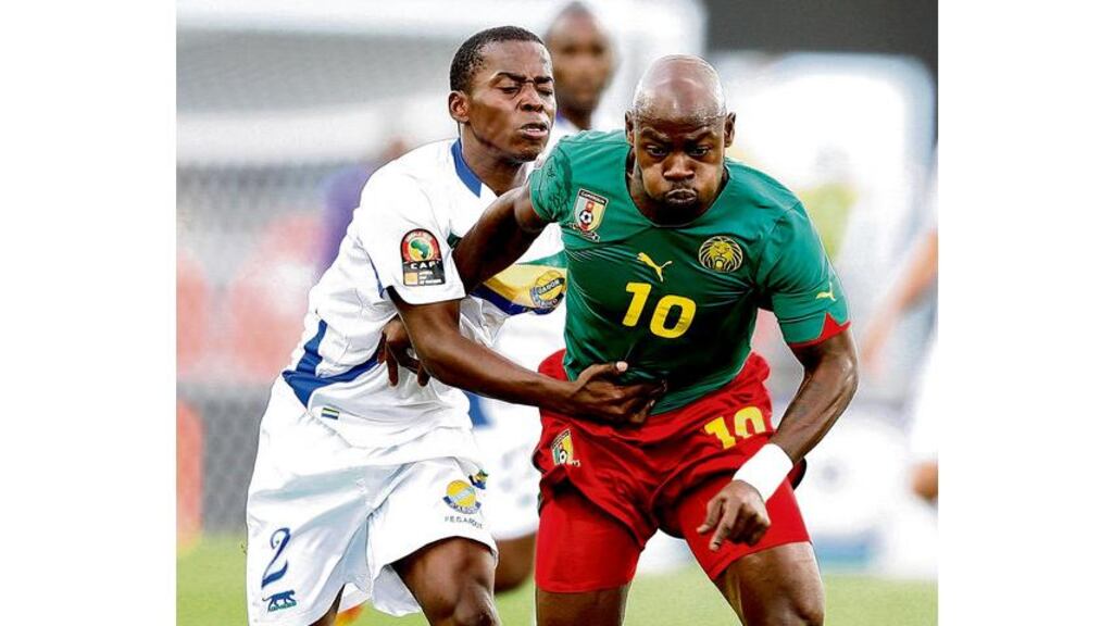 Cameroon's Achille Emana (right), is challenged by Gabon's Georges Ambourrouet at Tundavala Stadium yesterday.