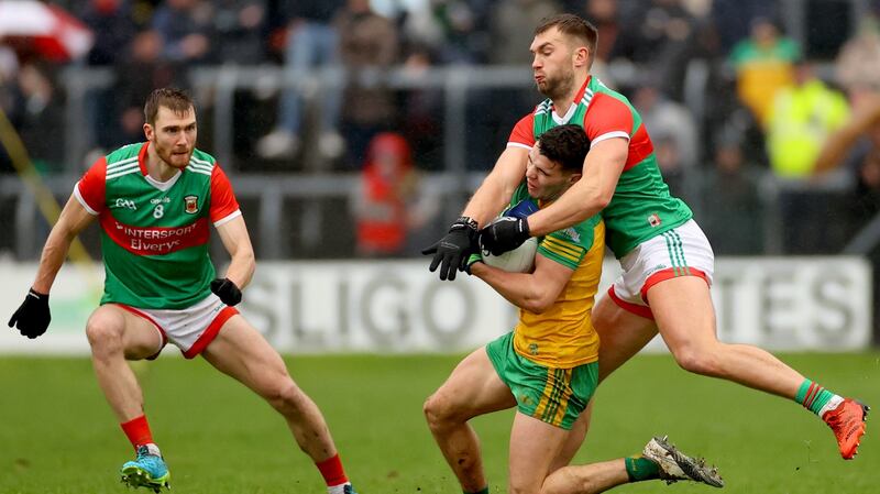 Mayo’s Conor and Aidan O’Shea tackle Odhran McFadden Ferry. Photograph: James Crombie/Inpho