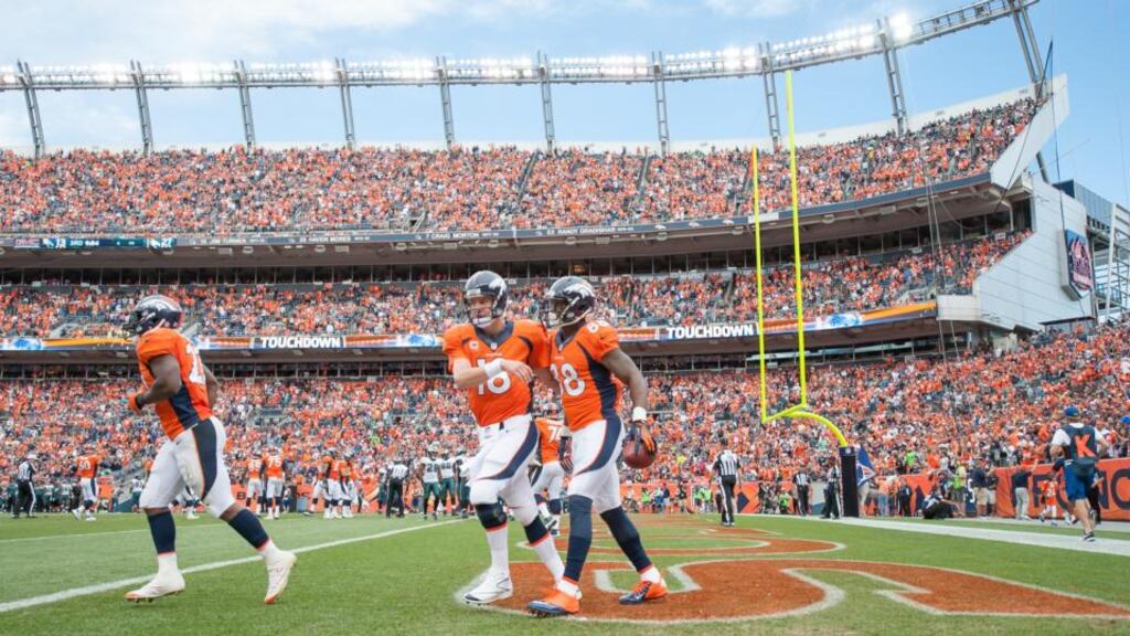 Denver Broncos quarterback Peyton Manning celebrates with  wide receiver Demaryius Thomas after the pair combined for   a third quarter touchdown against the Philadelphia Eagles  at the  Mile High Stadium in Denver, Colorado. Photograph: Dustin Bradford/Getty Images