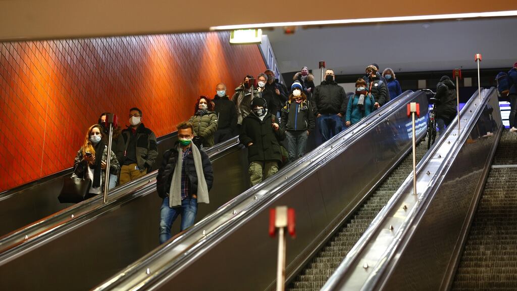 Morning rush-hour commuters wearing face masks at Nuremberg central railway station. Photograph: Michaela Handrek-Rehle/Bloomberg