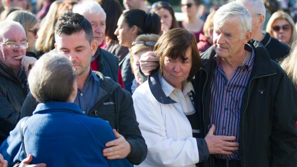 Marian and John Buckley, the parents of Karen Buckley, stand with their son Kieran (left) during a vigil for Karen in George Square, Glasgow. Photograph: Jane Barlow/PA Wire.