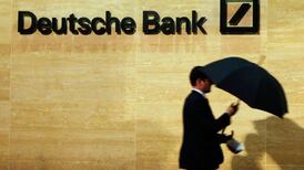 Deutsche Bank reports surprise quarterly loss
