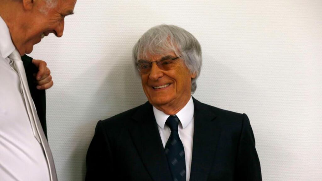 Formula One chief executive Bernie Ecclestone talks with hislawyer Sven Thomas (L) before the continuation of his trial at the regional court in Munich today. Photograph: Michael Dalder/Reuters.