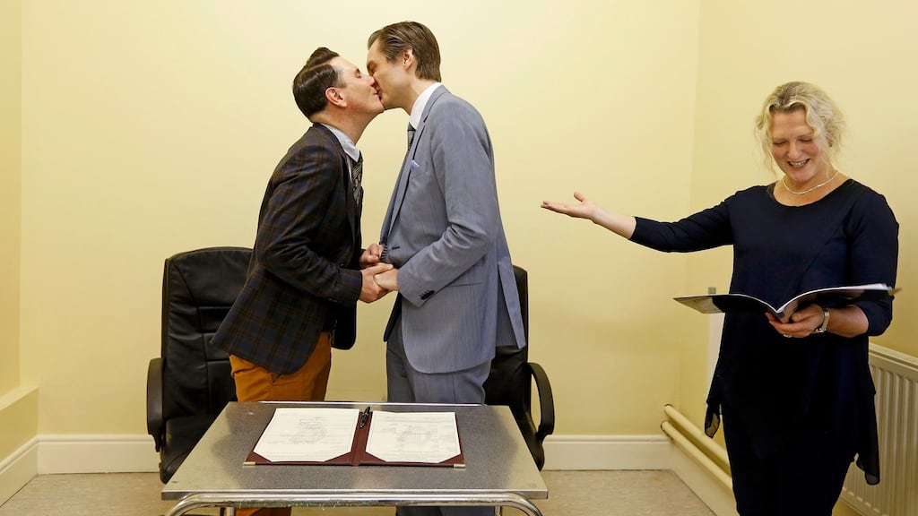 Richard Dowlin (L), 35, and Cormac Gollogly, 35, are married by registrar Mary Claire Heffernan in the South Clonmel Community Care Centre in County Tipperary on November , 17, 2015. Dowlin and Gollogly are the first gay couple to marry in Ireland. REUTERS/Cathal McNaughton