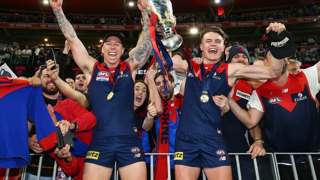 James Harmes and Bayley Fritsch of the Demons celebrate with fans at Perth Stadium. Photograph: Gary Day/Getty Images