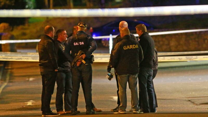 Detectives at the scene of the shooting last night. Photograph Nick Bradshaw