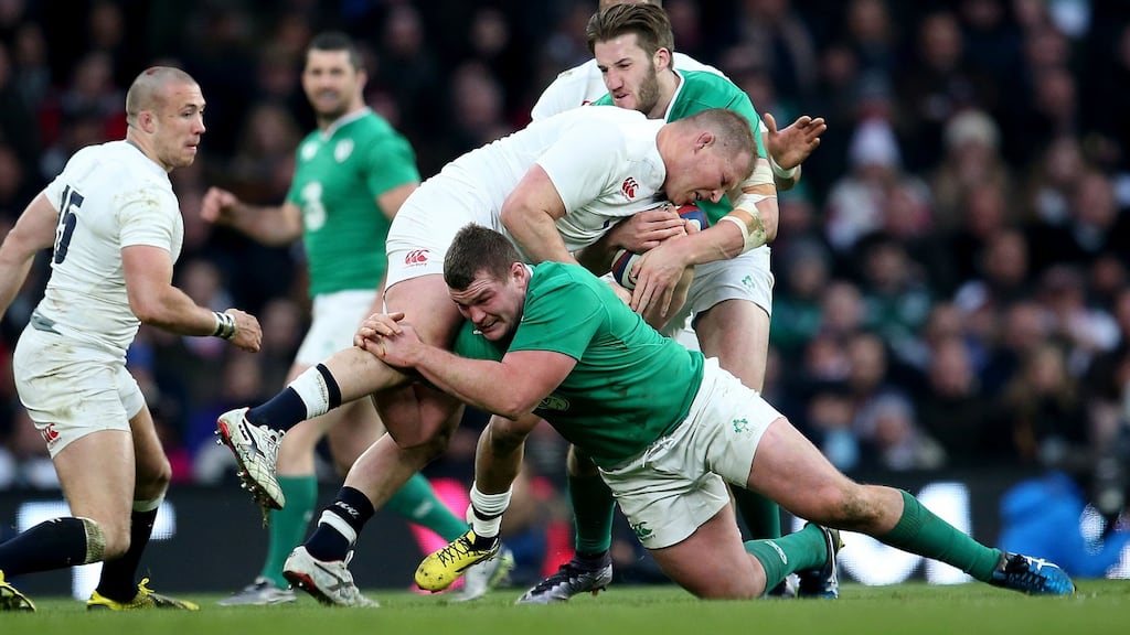Jack McGrath tackles Dylan Hartley in last seasons Six Nations clash at Twickenham. Photograph: Dan Sheridan/Inpho