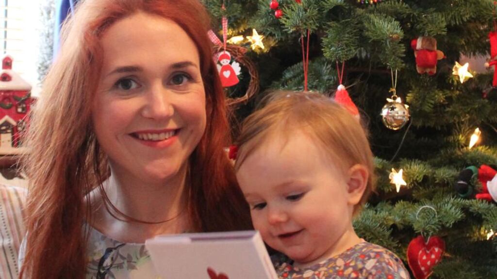 Gail Condon and her daughter Rosie holding Writing for Tiny’s Christmas book
