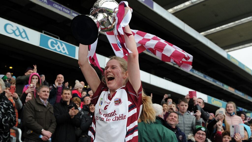 Slaughtneil’s Aoife Cassidy lifts the cup after the Derry club’s victory over Sarsfields in the All-Ireland senior club camogie final. Photograph: Tommy Grealy/Inpho