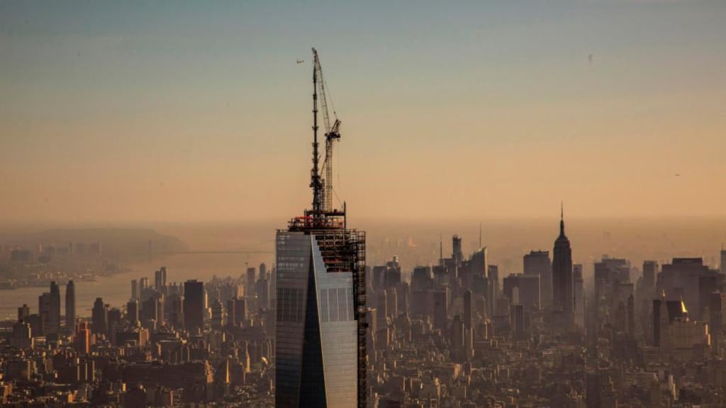 The final piece of the One World Trade Center spire is attached to the building by ironworkers in New York. Photograph: Gary He/INSIDER IMAGES/Handout via Reuters
