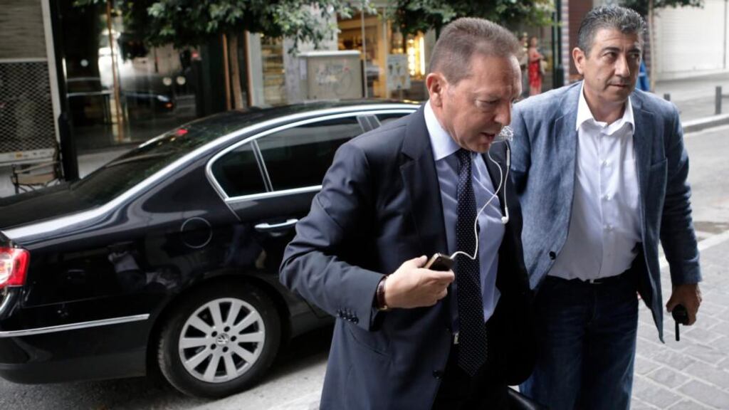 Greek finance minister Yannis Stournaras (left) arrives at the ministry for a meeting with officials of the European Union, European Central Bank and International Monetary Fund in Athens yesterday. Photograph: Reuters/John Kolesidis