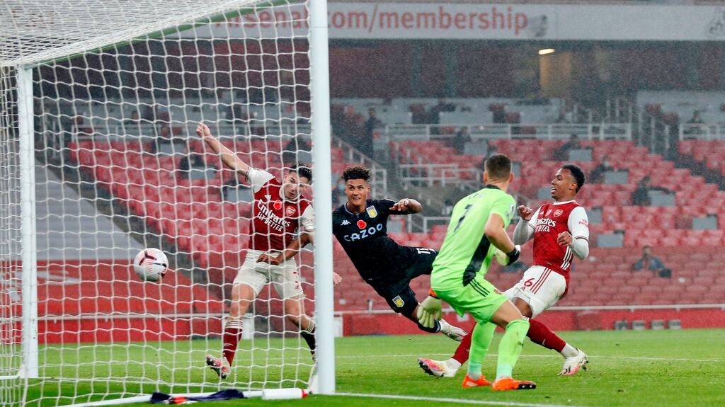 Aston Villa’s Ollie Watkins scores his team’s second goal past Arsenal’s Kieran Tierney at the Emirates Stadium. Photo: Alastair Grant/AFP via Getty Images