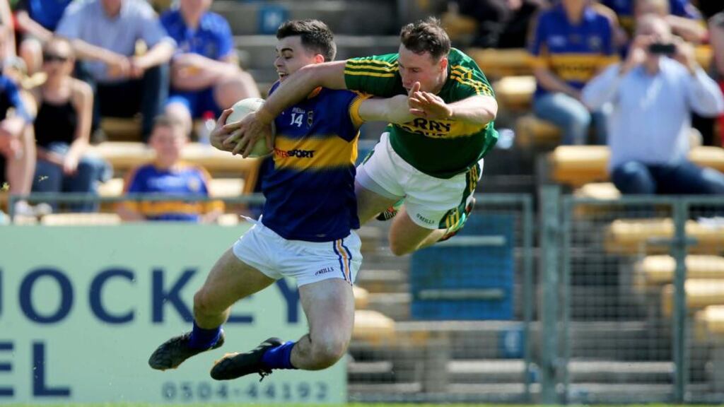 Tipperary’s Michael Quinlivan battles with Mark Griffin during Kerry’s Munster Championship semi-final win. Photograph: Inpho