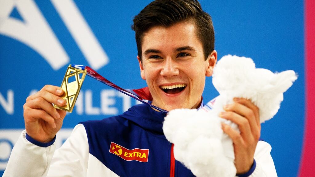 Jakob Ingebrigtsen  with his gold medal on the podium after winning the men’s 3,000m final at the  European Athletics Indoor Championships in Glasgow. Photograph: Robert Perry/EPA