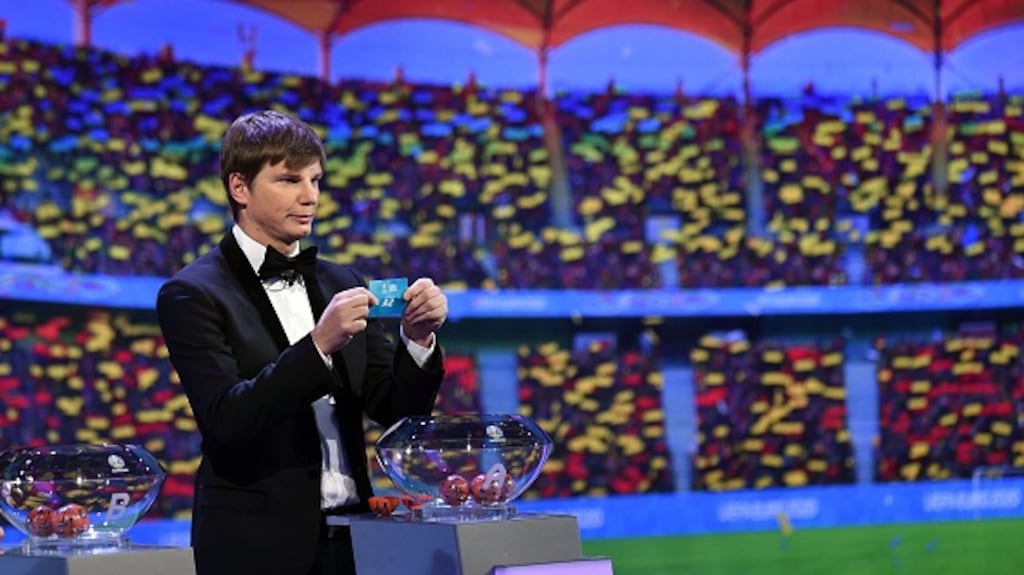 Andrey Arshavin drew team names at the now void draw.  Photograph:  Tullio Puglia/UEFA/Getty Images