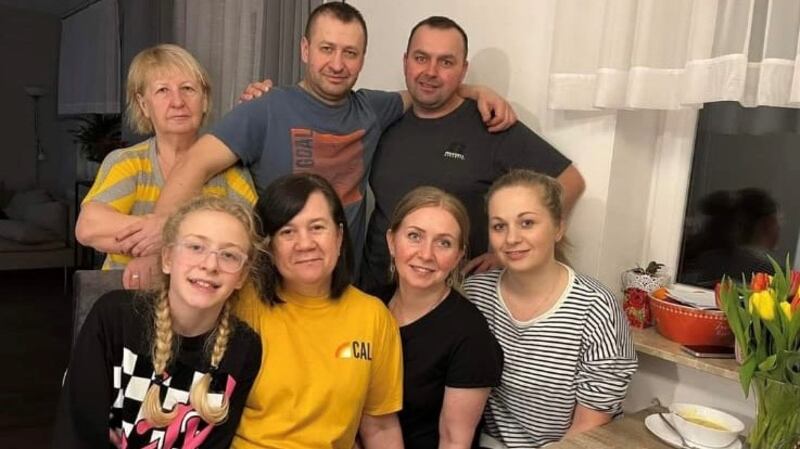 Pic of Katya (second from left at front) . Also in the photo are her husband Igor, daughter Victoria and people who helped them in Poland.