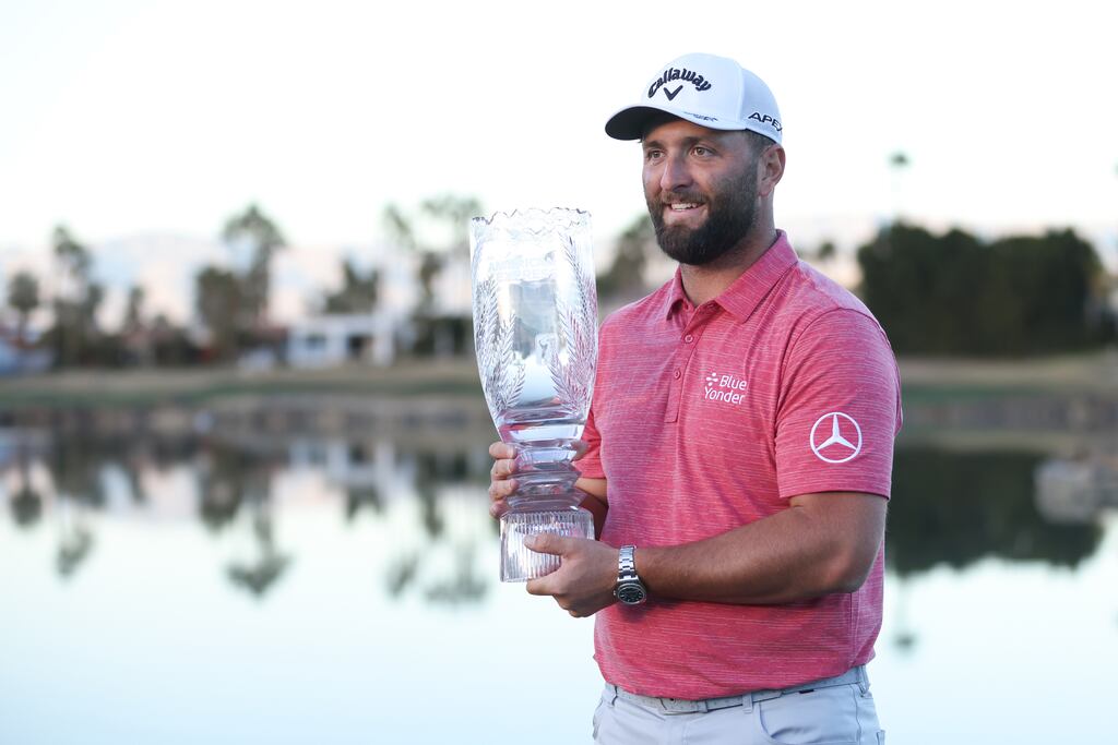 Jon Rahm of Spain celebrates with the trophy after winning The American Express at PGA West Pete Dye Stadium Course. Photograph: Katelyn Mulcahy/Getty