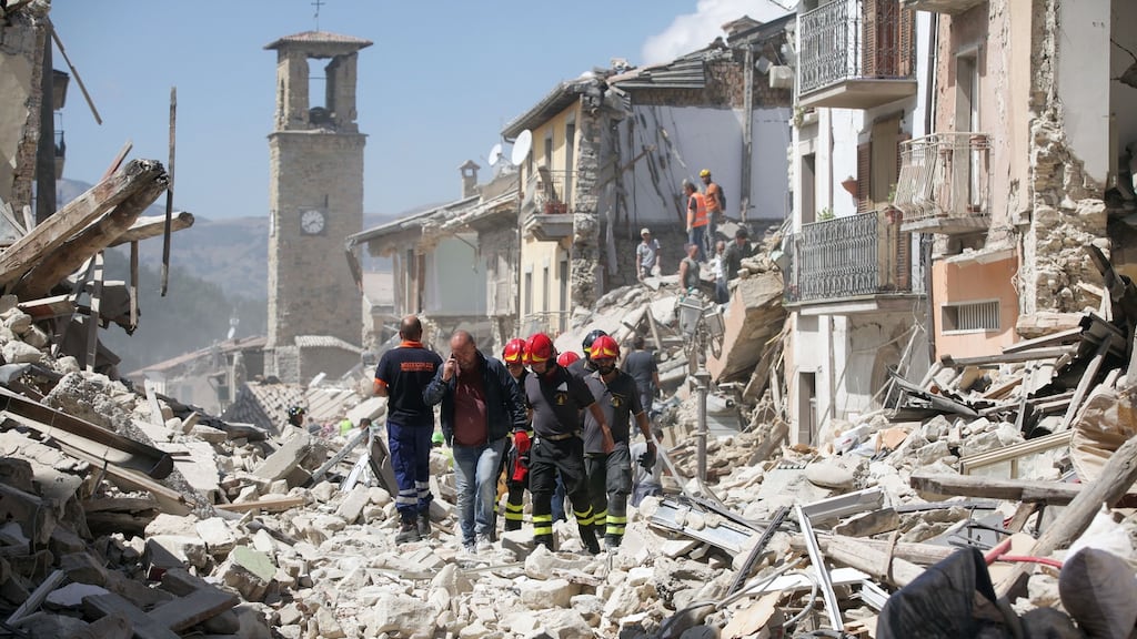 Rescue workers search for survivors in the rubble of Amatrice, Italy, on Wednesday. Photographer: Alessia Pierdomenico/Bloomberg