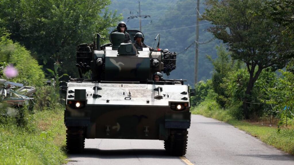 South Korean soldiers ride on an armored vehicle along a road in the border county of Yeoncheon on Saturday afternoon. Top aides to the leaders of North and South Korea will meet at the Panmunjom truce village straddling their border on Saturday, the South said, raising hopes for an end to a standoff that put the two sides on the brink of armed conflict. Photograph: AFP/Getty Images