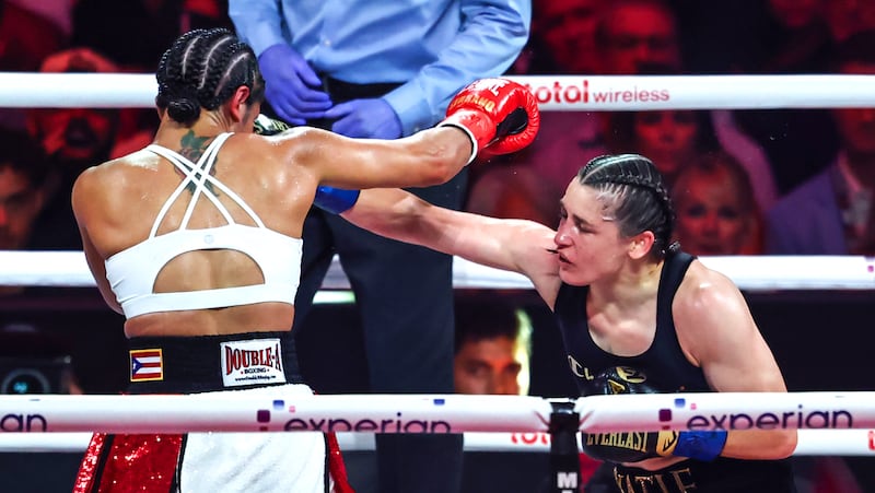 Katie Taylor dodges Amanda Serrano. Photograph: Gary Carr/Inpho