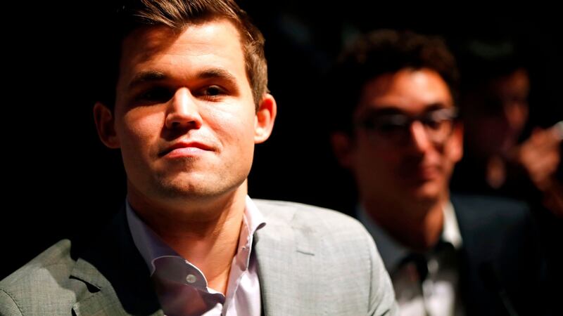 Magnus Carlsen with his challenger Fabiano Caruana. Photograph: Tolga Akmen /AFP/Getty Images