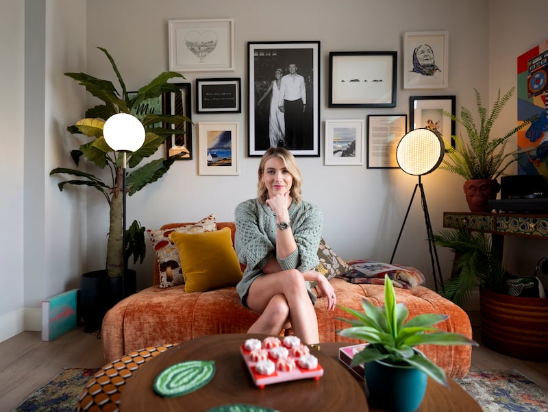 Louise Cantillon relaxes in her new home, painted in Dulux Heritage Romney Wool in Adare, County Limerick