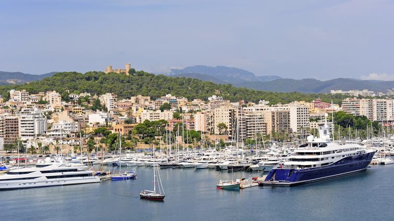 Marina in Palma De Majorca with Bellver castle on the hill.