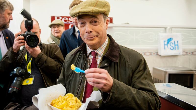Brexit Party leader Nigel Farage on a visit to a chip shop in Whitehaven. Photograph: Peter Powell