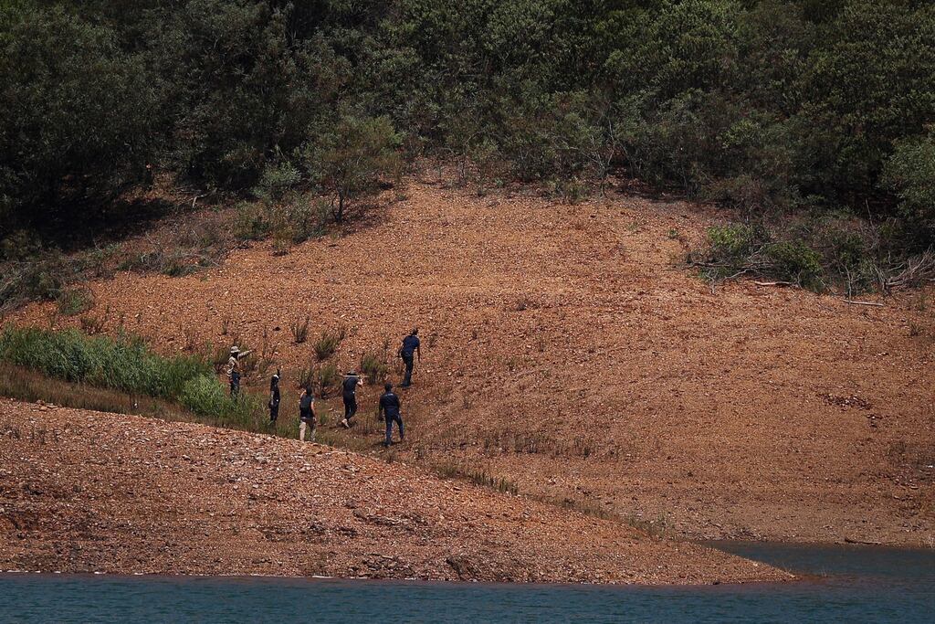 Portuguese judicial police criminal investigation unit members work in the Arade dam area, in Silves on May 25th, on the third day of new search operations amid the investigation into the disappearance of Madeleine McCann. Photograph: Filipe Amorim/AFP via Getty Images