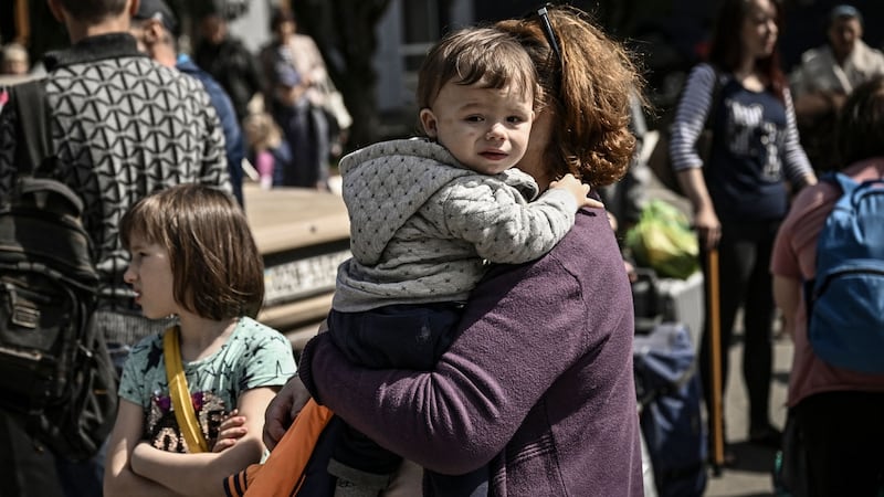 People evacuate the city of Bakhmut, in the eastern Ukranian region of Donbas on Tuesday. Photograph: Aris Messinis/AFP via Getty Images