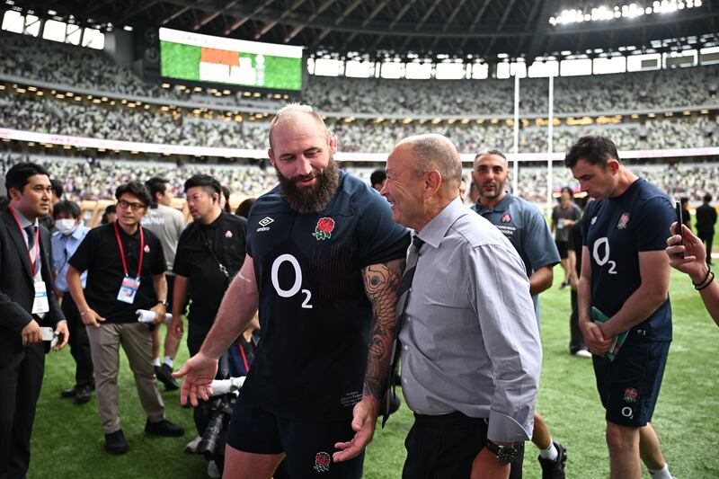 Former England boss and current Japan head coach Eddie Jones (centre R), speaks with England's Joe Marler. Photograph: Philiip Fong/AFP via Getty Images