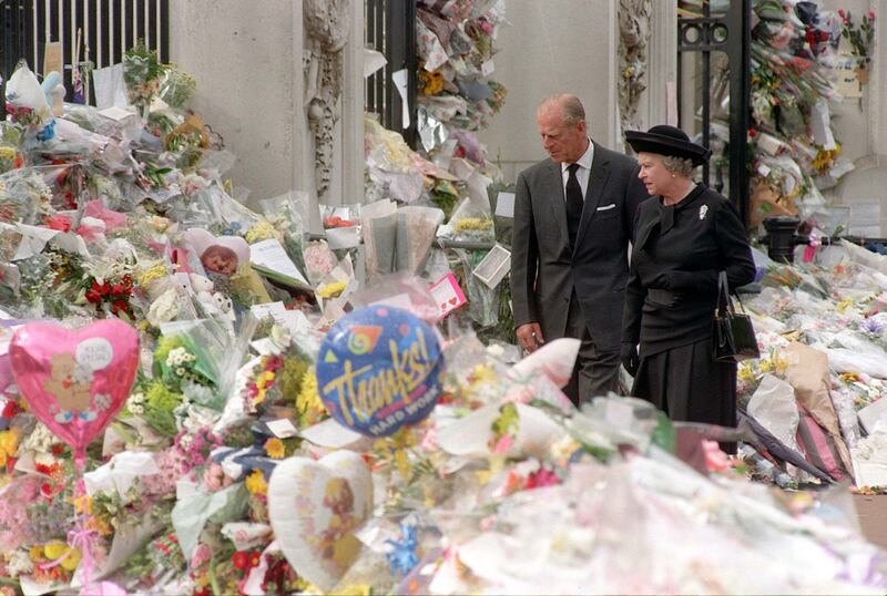 Queen Elizabeth and the Duke of Edinburgh viewing the floral tributes to Diana, Princess of Wales, at Buckingham Palace in 1997.