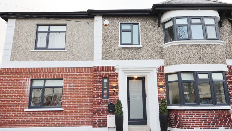 The newly-finished exterior of the house, complete with contemporary slate coloured windows and front door, allows access for Lynch’s parents to the side.