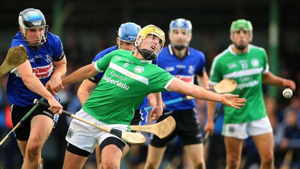 Kilmallock’s Jake Mulcahy battles with Cian McCarthy of Sarsfields during the Munster club semi-final at Kilmallock. Photo: Cathal Noonan/Inpho