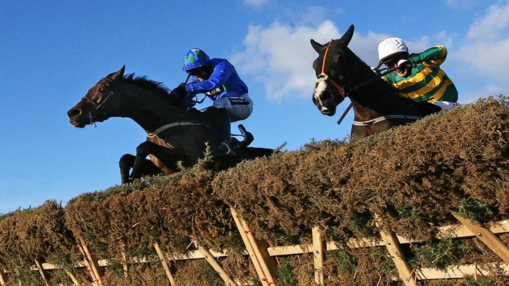 Ruby Walsh, left, on board Hurricane Fly clears the last hurdle ahead of Tony McCoy and Jezki during the Ryanair Hurdle at Leopardstown in December. Photograph: Cathal Noonan/Inpho